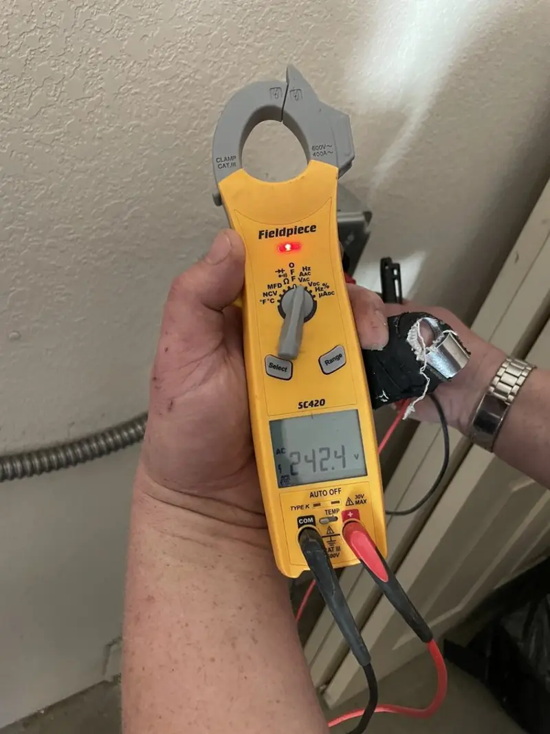 Voltage testing with clamp meter during Ceiling Fan Installation in Menifee